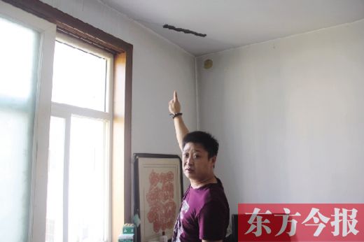 鶴壁一小區(qū)樓板斷裂數(shù)年無人管 律師稱開發(fā)商應根據(jù)實際損失加以賠償(圖)