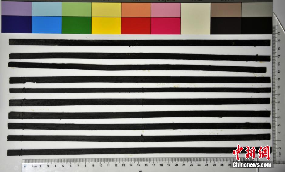 圖為漢代簡牘出土930支竹簡，在四川地區(qū)首次發(fā)現(xiàn)漢代簡牘。